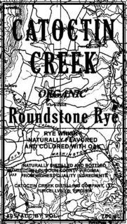 CATOCTIN CREEK ORGANIC ROUNDSTONE RYE RYE WHISKY NATURALLY FLAVORED AND COLORED WITH OAK NATURALLY DISTILLED AND BOTTLED IN LOUDOUN COUNTY VIRGINIA FROM HIGHEST QUALITY INGREDIENTS CATOCTIN CREEK DISTILLING COMPANY, LLC PURCELLVILLE, VIRGINIA 40% ALC BY VOL 750 ML trademark