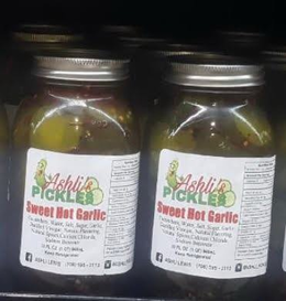 THE FONT AHSLI'S IS CURSIVE PICKLES BOLD FONT ASHLI'S IS LOCATED ON TOP OF PICKLES. trademark