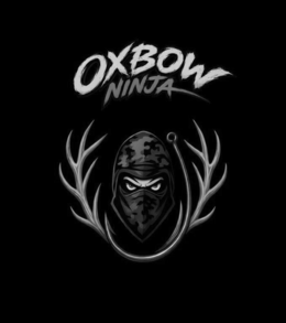 MAIN TEXT: "OXBOW" IN LARGE, BOLD, BRUSH-STROKE STYLE LETTERING WITH A SLIGHTLY DISTRESSED TEXTURE.SECONDARY TEXT: "NINJA" IN SMALLER, STYLIZED LETTERING POSITIONED DIRECTLY BELOW "OXBOW".CENTRAL FIGURE: A NINJA-STYLE BALACLAVA/MASK IN CAMOUFLAGE PATTERN, SHOWING ONLY THE EYES AND UPPER NOSE AREA. THE EYES HAVE A SHARP, INTENSE/ANGRY EXPRESSION WITH VISIBLE WHITE SCLERA AND DARK PUPILS.LEFT & RIGHT ANTLERS: LARGE, DETAILED DEER ANTLERS (BROWN/TAN WITH HIGHLIGHTS) SYMMETRICALLY FRAMING THE NINJA HEAD ON BOTH SIDES.FISH HOOK: A LARGE, METALLIC BRONZE/GOLD-COLORED FISHING HOOK CURVING FROM THE BOTTOM, LOOPING AROUND THE LOWER PART OF THE NINJA HEAD AND CONNECTING NEAR THE RIGHT ANTLER. trademark